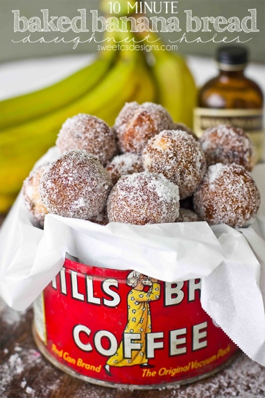 picture of banana bread donut holes in a tin with bananas in the background. 